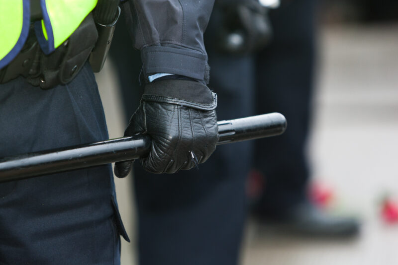 Nightstick in the hand of a peace officer during a demonstration in montreal Québec Canada
