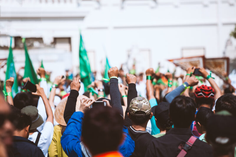 People raised hand air fighting for protest